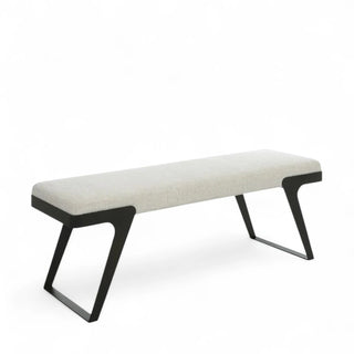 White boucle bench with black metal sled legs shown against white background