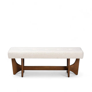 White boucle bench with button tufted seat and sculptural walnut brown wooden base