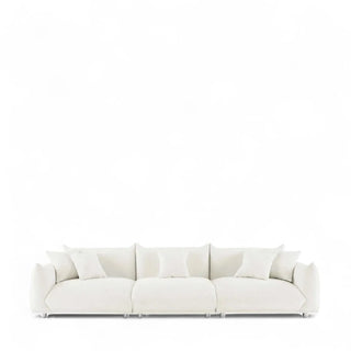 Front view showcasing the modern boucle couch with deep seat cushions and chrome metal legs.