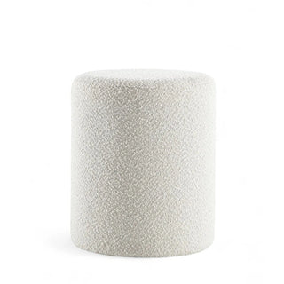White boucle round ottoman with tufted upholstery shown against white background