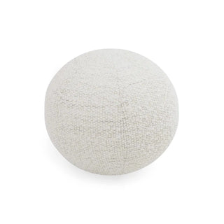 Close-up of the round white boucle cushion, emphasizing the spherical shape and textured fabric surface.
