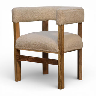 Wooden chair with beige cushioned seat and backrest on a white background