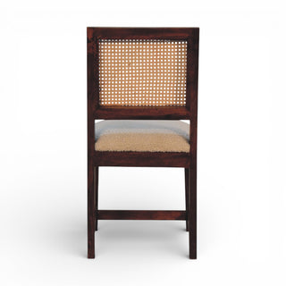 Wooden chair with a woven backrest on a white background