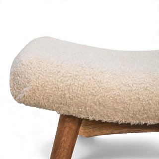 Side close-up of the Bouclé Bench Cream Curved Nordic highlighting the slim curved seat and cream bouclé upholstery.

