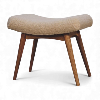 Close-up of the Bouclé Bench Cream Curved Nordic showing the textured cream bouclé fabric on the curved seat.

