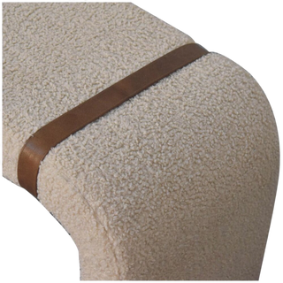 Close-up of the Bouclé Bench Cream Leather Strap focusing on the rounded corner, textured cream bouclé upholstery, and brown leather strap.

