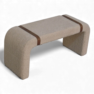 Side-top view of the Bouclé Bench Cream Leather Strap highlighting the arched leg design and leather strap detail across the seat.