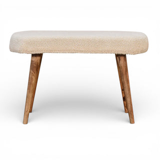 Front view of Bouclé Bench in cream with Nordic style mango wood legs and curved cushioned seat

