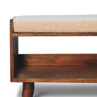 Side angled view of the Bouclé Bench Cream Nordic Storage focusing on the cushioned cream bouclé top and rich wood grain frame.

