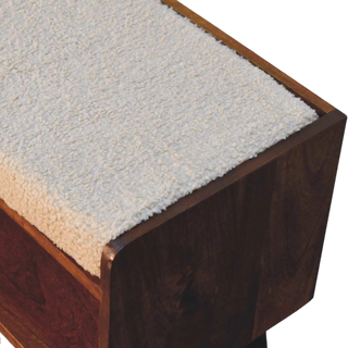 Close-up of the Bouclé Bench Cream Nordic Storage focusing on the textured cream bouclé upholstery and smooth wooden corner detail.

