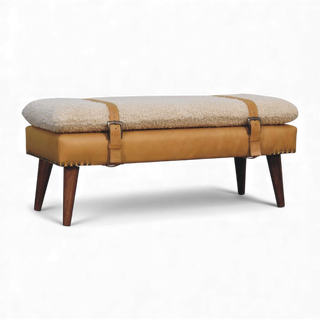 Three-quarter angled view of the Bouclé Bench Cream Tan Leather X-Strap from the right side displaying the cream bouclé cushion, tan leather base, and splayed legs.

