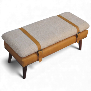 Top angled close-up of the Bouclé Bench Cream Tan Leather X-Strap focusing on the textured cream bouclé upholstery and crossing tan leather X-strap detail.

