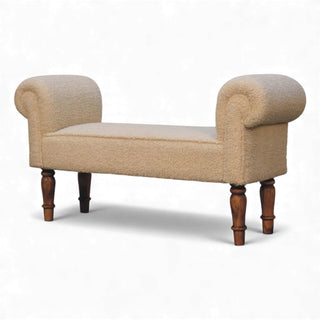 Three-quarter angled view of the Bouclé Bench Cream Turned-Leg Classic from the left side showing both arms and turned wooden legs.