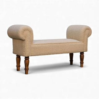 Three-quarter angled view of the Bouclé Bench Cream Turned-Leg Classic from the right side showing the full bench and wooden turned legs.