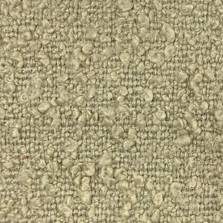 Close-up of champagne tweed fabric showing warm metallic weave pattern.