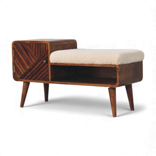Angled side view of mid-century modern dark wood bench with cushion and storage space.