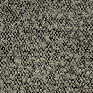 Close-up of olive tweed fabric displaying woven pattern with varied green tones.