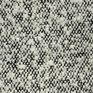 Close-up of silver tweed fabric featuring marled texture with contrasting flecks.